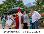 Small photo of Rio de Janeiro, Brazil - December 1, 2019: Sinterklaas and his assistants arriving on the city lake shore in Rio de Janeiro where Dutch community has gathered and vice consul welcomes them