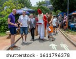 Small photo of Rio de Janeiro, Brazil - December 1, 2019: Vice consul of The Netherlands walking with Sinterklaas and his assistants on the city lake shore in Rio de Janeiro where Dutch community has gathered