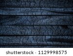 BBQ background. Burnt wooden Board texture. Burned scratched hardwood surface. Smoking wood plank background. Burned wooden grunge texture