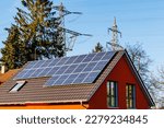 Small photo of Solar battery on the roof of house near Electrical towers. PV plants generate your own electricity plug play. Power photovoltaic plant. Solar Panel energy system.