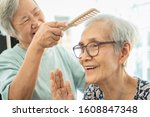 Small photo of Happy asian elderly women,female senior combing hair to friend senior woman in nursing home,smiling old people or sister care,support,talk, good time together, sprightly, friendship of retirement age