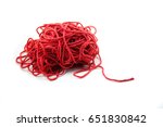 Pile of tangled red yarn with a single end leading out. Isolated on white
