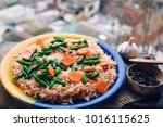 Small photo of Healthy food. Rise basmati with vegetables. Vegan food. Basmati rice pakistani basmati asian basmati cooked white rice in a plete on a wooden table.