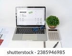 Small photo of Close-up difference invoices and bills, document and paperwork. Digital Tax E Invoice Online Software On Laptop Screen. Online Electronic Bill Management