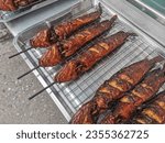 Small photo of Catfish were grilled and laid down on tray,Grilled catfish, street food in Thailand.