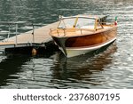 Old wooden motorboat on lake...
