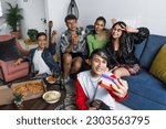 latin LGBT friends taking photo selfie with mobile phone and having fun at home in Mexico, Hispanic homosexual and lgbtq community in Latin America