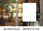 Small photo of White paper mockup or white promotion poster displayed on the front of the restaurant, coffee shop Promotion information for marketing announcements and details
