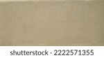 Small photo of background brown painted beige roughcast wall and trace of spatula facade home concrete seamless painted texture web header panorama