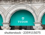 Small photo of Milan , Italy - 09 06 2023 : tudor logo brand facade and text chain entrance sign switzerland watches wall shop jewellery boutique