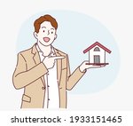 young business man holding home ... | Shutterstock .eps vector #1933151465
