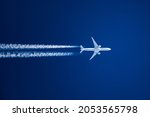 Small photo of Sharp telephoto close-up of jet plane aircraft with contrails cruising from Tokyo to Chicago, altitude AGL 35,000 feet, ground speed 533 knots.