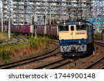 Small photo of Osaka, Japan - October 6, 2019 : Japan Freight Railway Company (JRF) Locomotive EF65-2074 of freight train passing Kishibe Station in Suite, Osaka, Japan