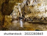 Underground caves featuring stalactites and stalagmites