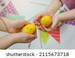 Children Hold Yellow Easter...