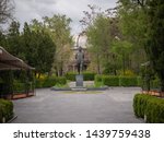 Small photo of YEREVAN, ARMENIA - APRIL 20, 2019 View of the Student's Park, the statue of prominent Armenian astrophysicist Victor Hambardzumyan and with University observatory in the background.