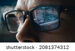 Small photo of Close-up Portrait of Software Engineer Working on Computer, Line of Code Reflecting in Glasses. Developer Working on Innovative e-Commerce Application using Big Data Concept
