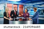 Small photo of Talk Show TV Program: Four Diverse Specialists, Experts, Guests, Presenter, Host Discuss and Argue about Politics, Economy, Science, News. Mock-up Television Cable Channel Studio Debate