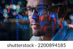 Small photo of Stock Market Trader Working Investment Charts, Graphs, Ticker, Diagrams Projected on His Face and Reflecting in Glasses. Financial Analyst and Digital Businessman Selling Shorts and Buying Longs