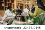 Small photo of Female Manager Leading a Meeting About Sustainability and Ethnicity with her Multiethnic Teammates. Young Group of Employees Presenting Their Project Ideas To Startup CEO. Medium Shot