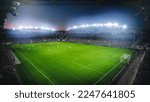 Small photo of High Angle Establishing Shot: Stadium with Soccer Championship Match. Teams Play, Crowds of Fans Cheer. Football Cup Tournament. Sport Channel Television Concept, Screen Content
