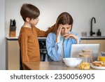 Small photo of Teenage boy calms down mother. Empathetic sympathetic child strokes frustrated sad tired stressful mom on head, helping to cope with tension. Emotionally close family, warm relationships.