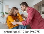 Small photo of Despotic, rude, jealous husband angry with wife, shocked by betrayal, ready to hit. Woman under stress suffers from aggression, domestic violence, rejects infidelity. Unhappy marriage, family discord