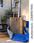 Small photo of Rusty Radiator dismounted in a street on Blurred Background