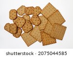 Bunch of spicy whole wheat and rye crackers. Isolated. Top view, flatlay.
