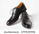 Black leather male shoes, white background