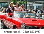 Small photo of Miss Immigrants are seen on Sixth Avenue during the Asian American and Pacific Islander Cultural and Heritage Parade in New York City, on May 21, 2023.