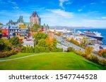 Skyline view of Old Quebec City with iconic Chateau Frontenac and Dufferin Terrace against St. Lawrence river in autumn sunny day, a national historic site of Canada, most famous landmark of Quebec.
