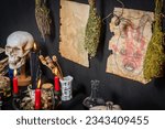 Small photo of Witchcraft ritual ceremony. Alchemy and esoteric symbol items for magic cult. Spiritual occultism magic chemistry inspired by mysticism. Witch and warlock magician concept. Halloween craft.
