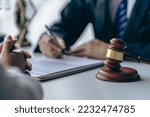 Small photo of Office with sledgehammer in front, lawyers and clients discussing court issues or justice at meeting Law and order. The concept of courts and legislatures
