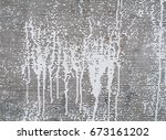 white paint on gray canvas.... | Shutterstock . vector #673161202
