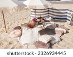 Luxuary setup picnic in Boho style on a beach, park. Bachelorette party, birthday celebration outdoors, wedding. 