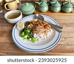 Small photo of Stewed pork legs with rice (Khao Kha Mu), selective focus. Khao Kha Mu is a famous delicious Thai - Chinese cuisine