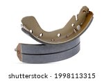 Small photo of car brake shoe part for service repair isolated on white background. auto drum brake shoes cut out.