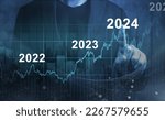 Small photo of economic recovery after falling due to inflation, stagnation, recession, 2024 financial chart. Businessman pointing graph of future growth on dark blue background