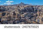 Small photo of From the lofty peak, Goreme town unfolds like a tapestry of history and wonder, its unique formations and ancient dwellings echoing tales of bygone eras.