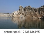 Small photo of The Narmada, making its way through the Marble Rocks, Narrows down and then plunges in a waterfall known as Dhuandhar or the smoke cascade. So powerful is the plunge that its roar is heard from a far