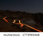 Al Hada Mountains near Taif, dangerous Al Hada road mountain pass with night  time head light trails, in western Saudi Arabia