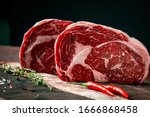Raw rib eye beef steak with...