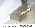 Hidden built-in hood. Kitchen cooker hood with filter. Home range hood in kitchen furniture. Forced ventilation to clean the kitchen from odors.