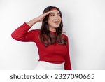 Beautiful Asian woman giving salute celebrate Indonesian independence day on August 17 isolated over white background