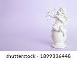 Figurine of an angel cupid with ...