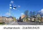 Small photo of On official flag days, Finnish flags fly everywhere in the city. The city is still quiet on a Sunday morning before the shops open