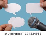 Conference, interview or social media concept with microphone and blank speech bubbles