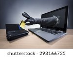 Stealing a credit card through a laptop concept for computer hacker, network security and electronic banking security