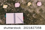 Small photo of Notebook pen and crumpled paper on rustic floor. Mistake Learning, wrong, blooper, error, regret sayings background. Feelings, apology, message, love, in relationship friendship concept. Flat Lay